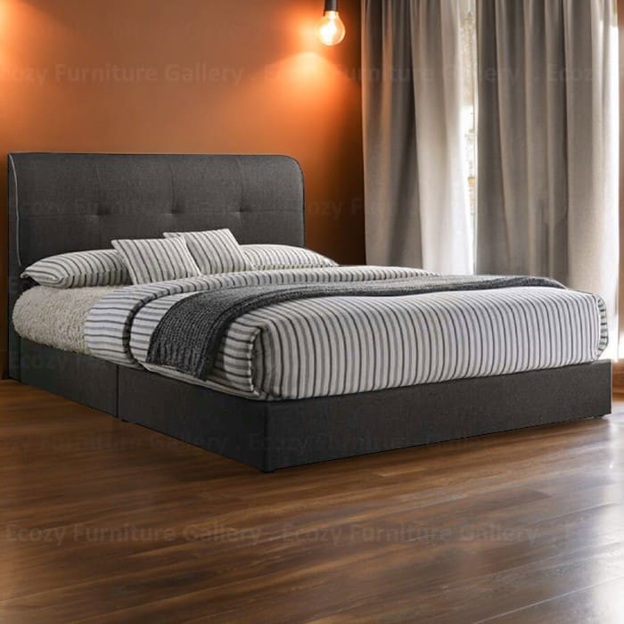 A modern divan bed upholstered in grey color faux leather, it is features a sleek design with a simple and plain headboard