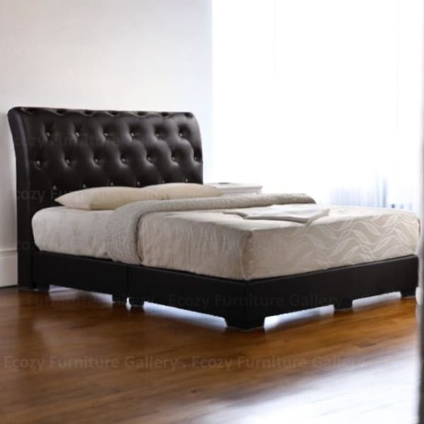 A black upholstered bed frame with a slightly curved, tufted crystal headboard and black legs