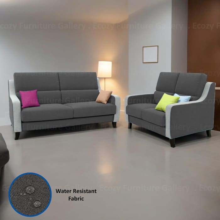 A dark grey water repellent fabric sofa with light grey arms and base, upholstery with water repellent fabric, it's ideal for any home in Singapore