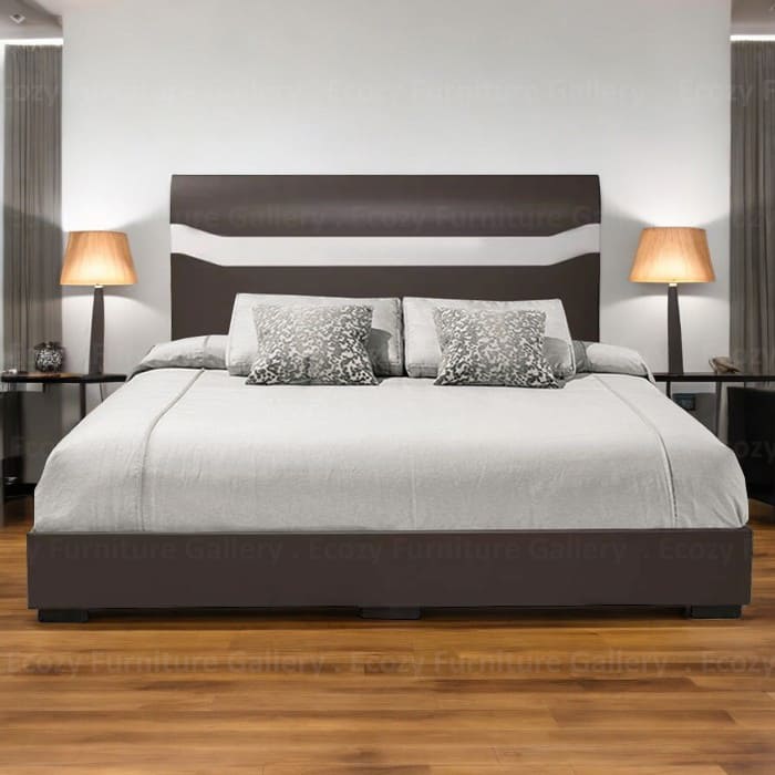 the front view of modern bed with a dark brown frame and a headboard featuring a white horizontal stripe in a room with wooden flooring and lamp