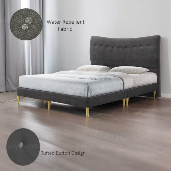 A dark grey upholstered bed frame with a slightly curved, tufted button headboard and light wooden legs. The bed is made with water-repellent fabric