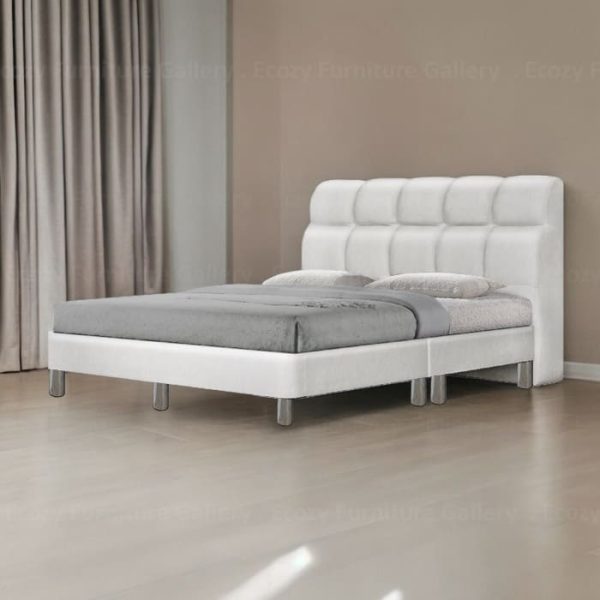 A modern divan bed upholstered in white color faux leather, it is features a sleek design with a cushioned headboard