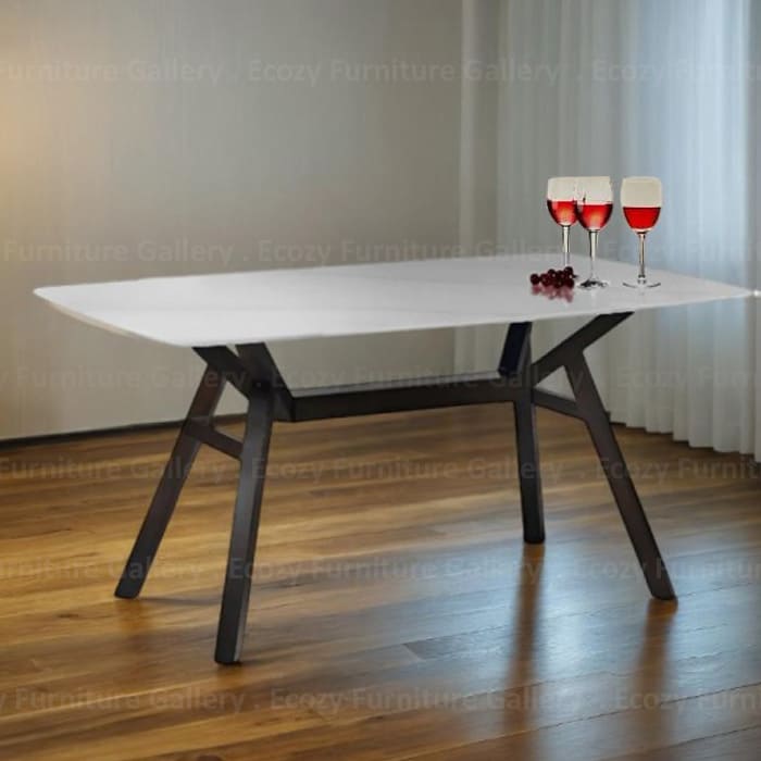 A white color sintered stone dining table feature with solid wooden leg, set in a contemporary room with soft lighting