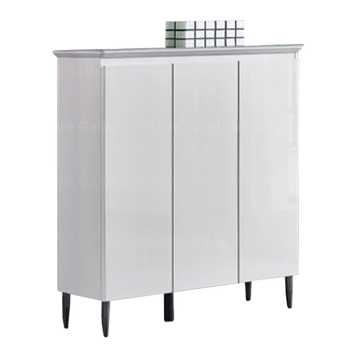 Shoe cabinet with three doors, featuring grey tempered glass top, styled with decorative items on top