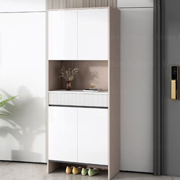 Shoe cabinet featuring a glossy white table top, with a modern design that includes upper storage space, lower compartments for shoes, and styled with decorative items on center's open compartment