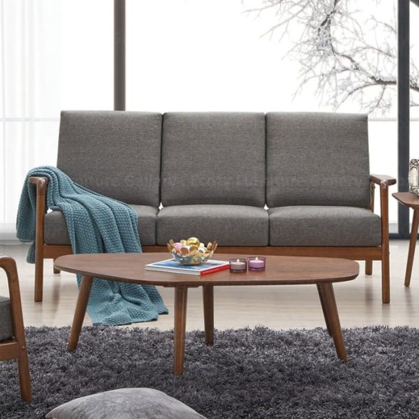 Wooden Sofa with a grey fabric cushion, featuring wooden armrests and a sleek design, set in a cozy living room with warm lighting and wooden flooring