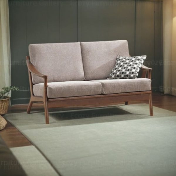 Wooden Sofa with a light brown fabric cushion, featuring wooden armrests and a sleek design, set in a cozy living room with warm lighting and wooden flooring