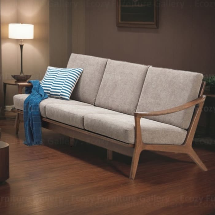 Wooden Sofa with a light brown fabric cushion, featuring wooden armrests and a sleek design, set in a cozy living room with warm lighting and wooden flooring