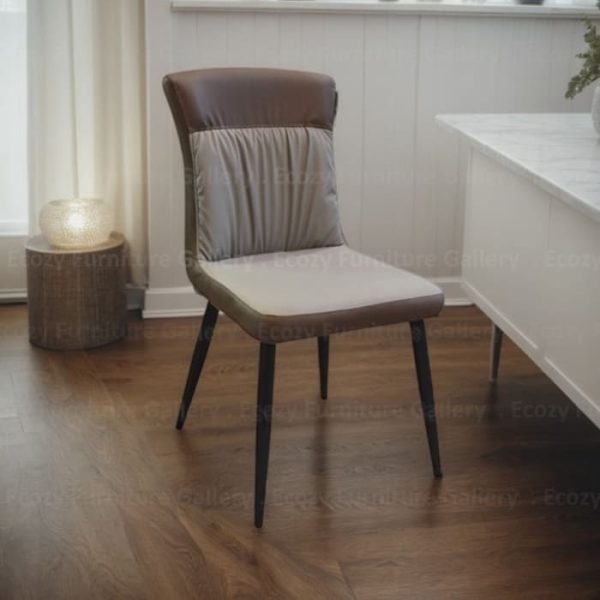 A modern dining chair featuring a leather seat and sleek black metal legs, ideal for modern dining spaces